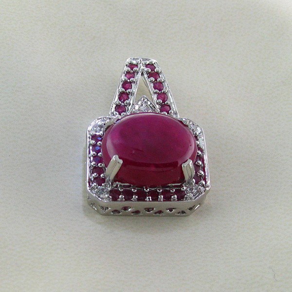 APP: 17k 26CT Ruby & Platinum Sterling Silver Pendant: 26.11CT Ruby and Platinum Overlay Sterling Silver Pendant - Appraisal Value: $17.1K - Bid with utmost confidence from GovernmentAuction.com. We have been in business for over 35 years, and pride ourse