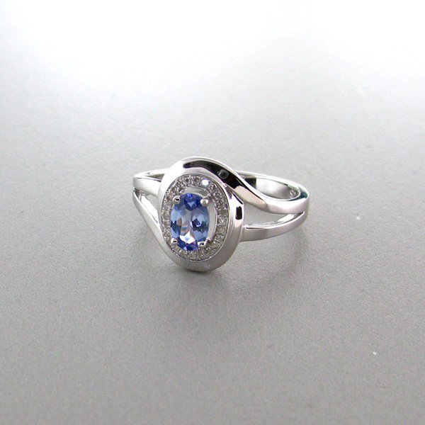 APP: 1k 18kt W Gold/Silver .5CT Tanzanite/Diamonds Ring: 18 kt. White Gold Overlay and Silver, 0.56CT Tanzanite and Diamonds Ring - Appraisal Value: $1.4K - Bid with utmost confidence from GovernmentAuction.com. We have been in business for over 35 years, a