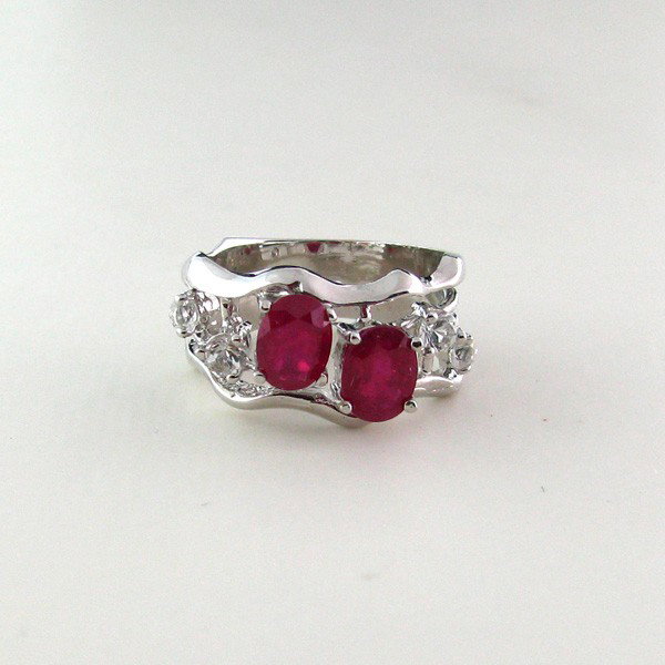 APP: 1k 1CTRuby w/Clear Topaz & Sterling Silver Ring: 1.95CT Ruby W/Clear Topaz and Sterling Silver Ring - Appraisal Value: $1.5K - Bid with utmost confidence from GovernmentAuction.com. We have been in business for over 35 years, and pride ourselves on 