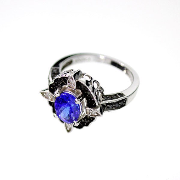 APP: 5k 18kt White Gold & Silver, 1k Diamond Ring: 18 kt. White Gold and Silver, 1.53CT Tanzanite and Black Diamond Ring - Appraisal Value: $4.9K - Bid with utmost confidence from GovernmentAuction.com. We have been in business for over 35 years, and 