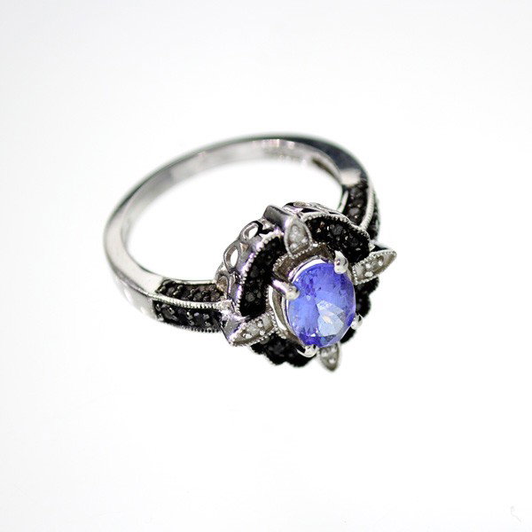 APP: 3k 18kt White Gold & Silver, 0k Diamond Ring: 18 kt. White Gold and Silver, 0.97CT Tanzanite and Black Diamond Ring - Appraisal Value: $3.5K - Bid with utmost confidence from GovernmentAuction.com. We have been in business for over 35 years, and 