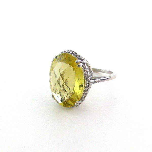 APP: 3k 18kt Gold/Silver 18CT Citrine/Diamond Ring: 18 kt. Gold and Silver Overlay, 18.57CT Lemon Citrine and Diamond Ring - Appraisal Value: $3.9K - Bid with utmost confidence from GovernmentAuction.com. We have been in business for over 35 years, and