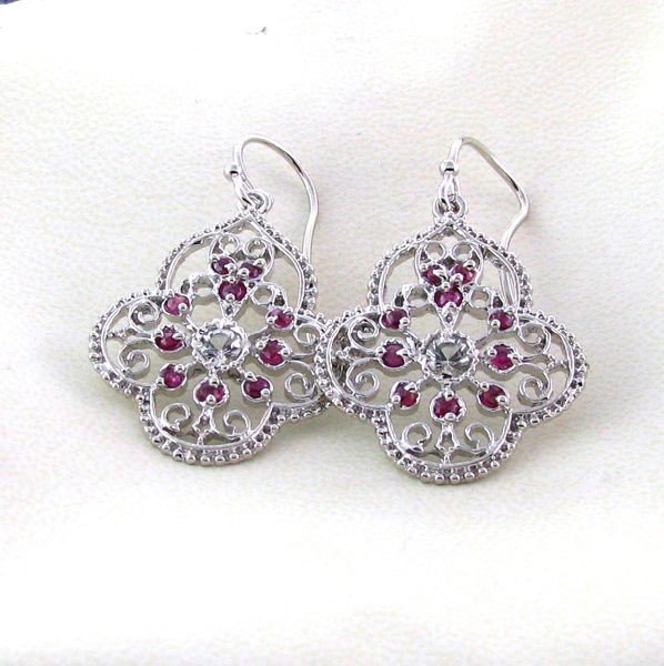APP: 2k 2CT Ruby w/Topaz & Plat Sterl Silver Earrings: 2.05CT Ruby W/Topaz and Platinum Overlay Sterling Silver Earrings - Appraisal Value: $1.9K - Bid with utmost confidence from GovernmentAuction.com. We have been in business for over 35 years, and prid