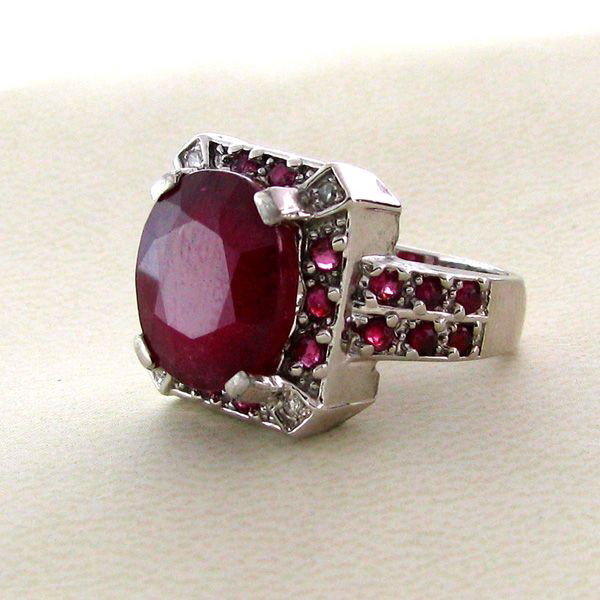 APP: 11k 9CT Ruby w/Rubies & Overlaid Sterl Silver Ring: 9.68CT Ruby W/Rubies and Platinum Overlayed Sterling Silver Ring - Appraisal Value: $11.2K - Bid with utmost confidence from GovernmentAuction.com. We have been in business for over 35 years, and prid
