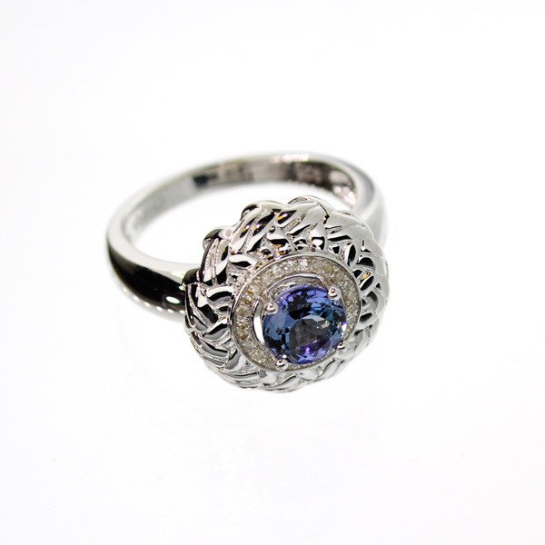 APP: 2k 18kt Gold/Silver, 0CT Tanzanite/Diamonds Ring: 18 kt. Gold and Silver Overlay, 0.73CT Tanzanite and Diamonds Ring - Appraisal Value: $2.1K - Bid with utmost confidence from GovernmentAuction.com. We have been in business for over 35 years, and pri