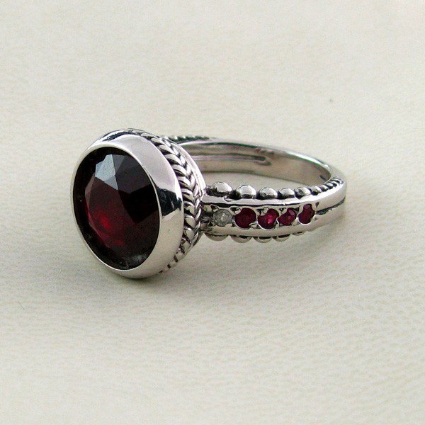 APP: 7k 7.78CT Ruby w/Diamond & Sterling Silver Ring: 7.78CT Ruby W/ Diamond and Sterling Silver Ring - Appraisal Value: $7.0K - Bid with utmost confidence from GovernmentAuction.com. We have been in business for over 35 years, and pride ourselves on per