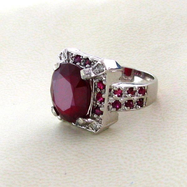APP: 11k 9CT Ruby & Platinum Overlaid Sterl Silver Ring: 9.66CT Ruby and Platinum Overlayed Sterling Silver Ring - Appraisal Value: $11.3K - Bid with utmost confidence from GovernmentAuction.com. We have been in business for over 35 years, and pride ourselv