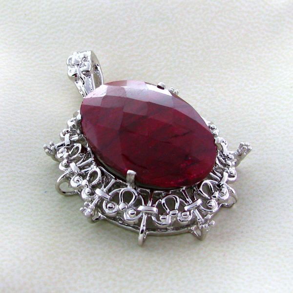 APP: 7.4k 58.93CT Ruby & Sterling Silver Pendant: 58.93CT Ruby and Sterling Silver Pendant - Appraisal Value: $7.3K - Bid with utmost confidence from GovernmentAuction.com. We have been in business for over 35 years, and pride ourselves on perfect cu