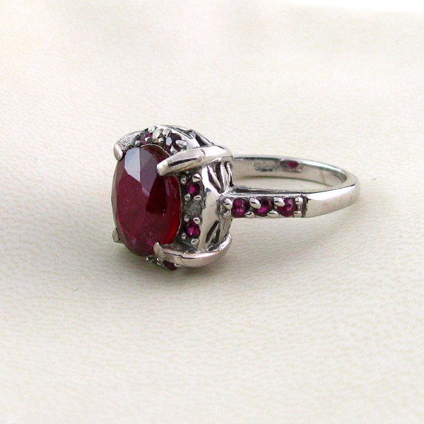 APP: 6.3k 5.29CT Ruby w/Diamond & Sterling Silver Ring: 5.29CT Ruby W/ Diamond and Sterling Silver Ring - Appraisal Value: $6.3K - Bid with utmost confidence from GovernmentAuction.com. We have been in business for over 35 years, and pride ourselves on per