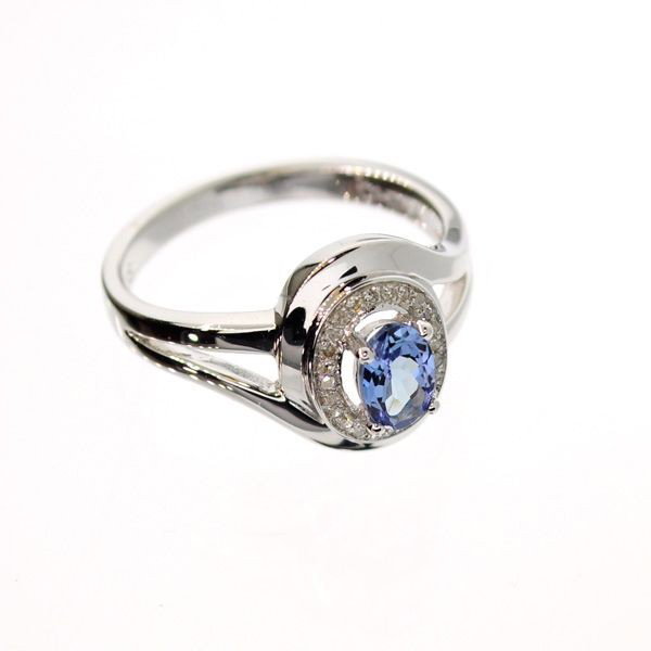 APP: 1k 18kt Gold/Silver Over Tanzanite/Diamonds Ring: 18 kt. Gold and Silver Overlay, 0.59CT Tanzanite and Diamonds Ring - Appraisal Value: $1.4K - Bid with utmost confidence from GovernmentAuction.com. We have been in business for over 35 years, and pri