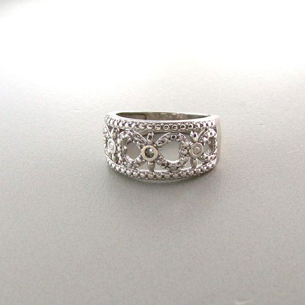 APP: 1k 18kt White Gold & Silver, 0CT Diamond Ring : 18 kt. White Gold Overlay and Silver, 0.08CT Diamond Ring - Appraisal Value: $1.1K - Bid with utmost confidence from GovernmentAuction.com. We have been in business for over 35 years, and pride oursel