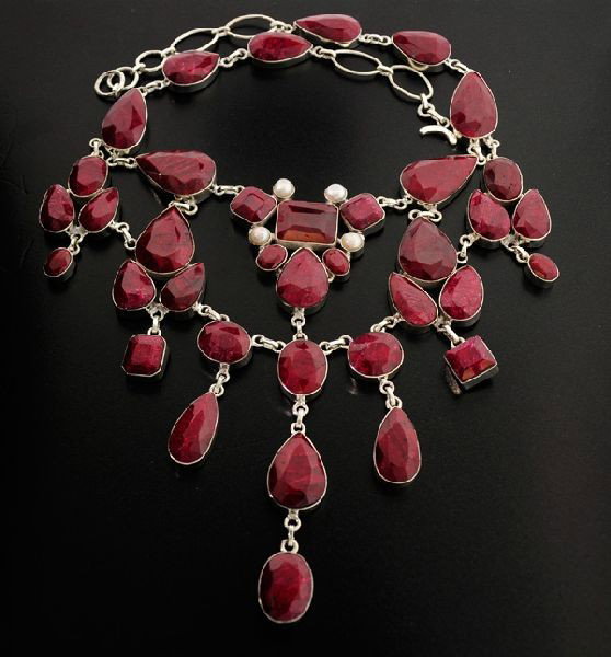 APP: 48k 320CTRuby w/Pearls & Sterling Silver Necklace: 320.72CT Ruby W/ Pearls and Sterling Silver Necklace - Appraisal Value: $48.2K - Bid with utmost confidence from GovernmentAuction.com. We have been in business for over 35 years, and pride ourselves 
