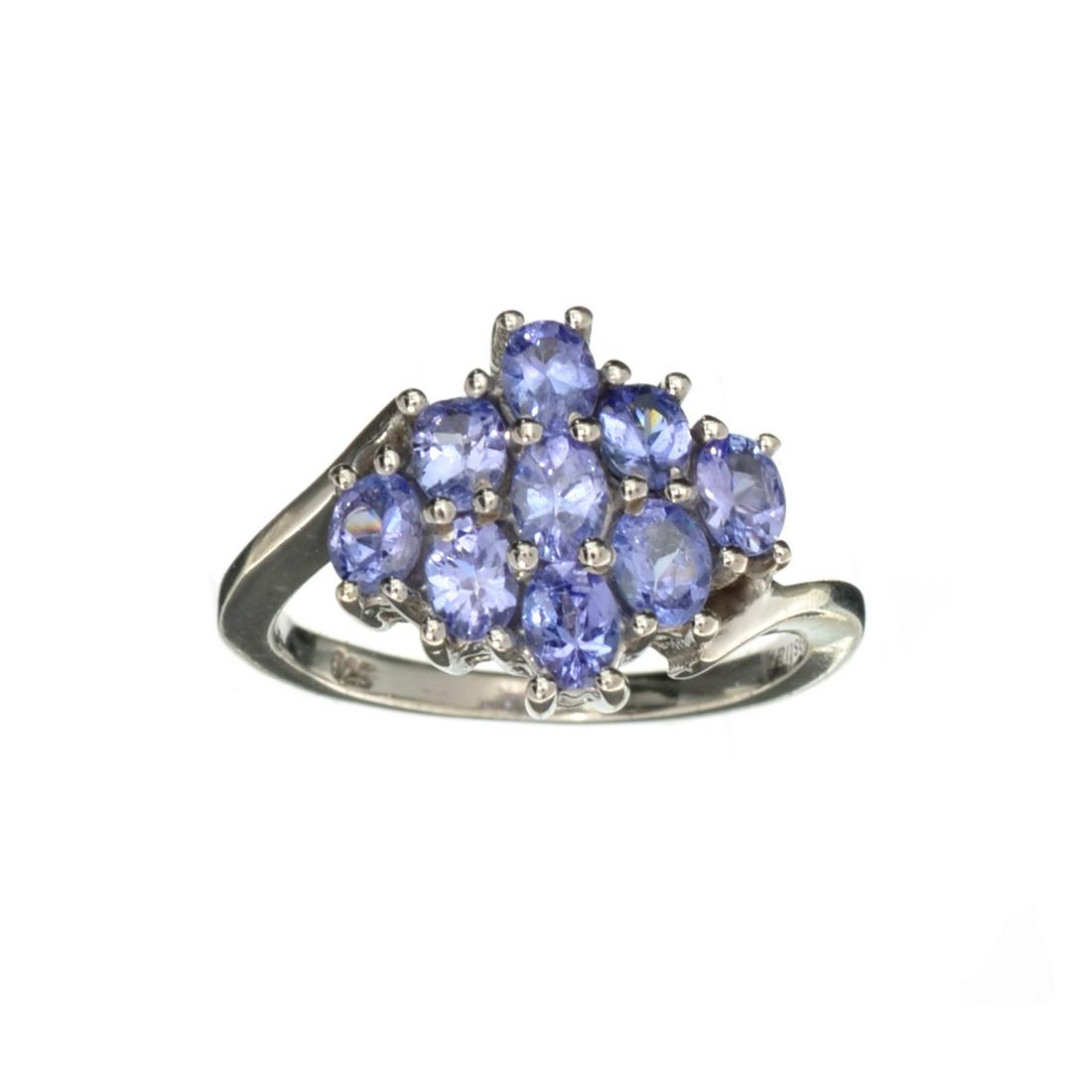 1.50CT Oval Cut Tanzanite And Sterling Silver Cluster Ring: Gov. File: H-20645 1.50CT Oval Cut Tanzanite And Sterling Silver Cluster Ring Retail Replacement Value: $1.4K Asset Type: Sterling Silver Ring Shipping: $19.95