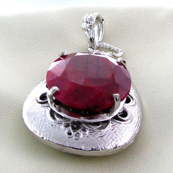 APP: 7.9k 48.46CT Ruby & Sterling Silver Pendant: 48.46CT Ruby and Sterling Silver Pendant - Appraisal Value: $7.8K - Bid with utmost confidence from GovernmentAuction.com. We have been in business for over 35 years, and pride ourselves on perfect cu