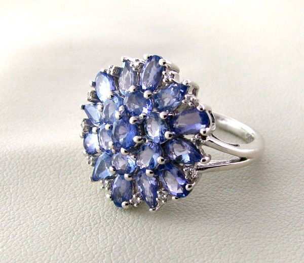 APP: 4k 18kt Gold, 4CT Tanzanite & Overlaid Silver Ring: 18 kt. Gold, 4.48CT Tanzanite and Platinum Overlayed Sterling Silver Ring - Appraisal Value: $4.3K - Bid with utmost confidence from GovernmentAuction.com. We have been in business for over 35 years,