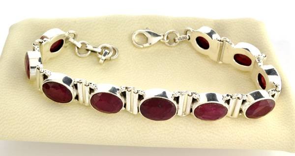 APP: 6k 36CTOval Cut Ruby & Sterling Silver Bracelet: 36.97CT Oval Cut Ruby and Sterling Silver Bracelet - Appraisal Value: $6.1K