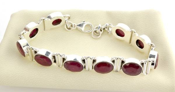 APP: 5k 31CTOval Cut Ruby & Sterling Silver Bracelet: 31.95CT Oval Cut Ruby and Sterling Silver Bracelet - Appraisal Value: $5.6K