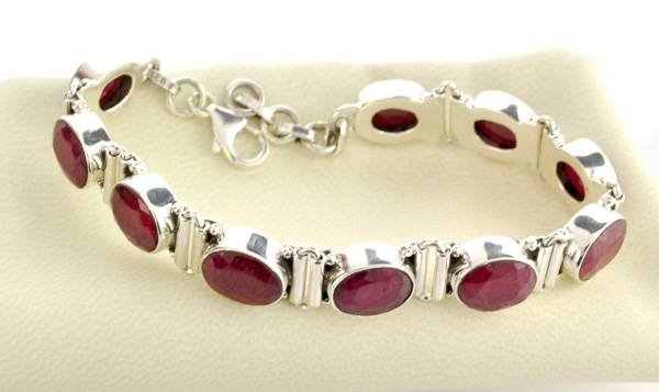 APP: 5k 33CTOval Cut Ruby & Sterling Silver Bracelet: 33.04CT Oval Cut Ruby and Sterling Silver Bracelet - Appraisal Value: $5.6K