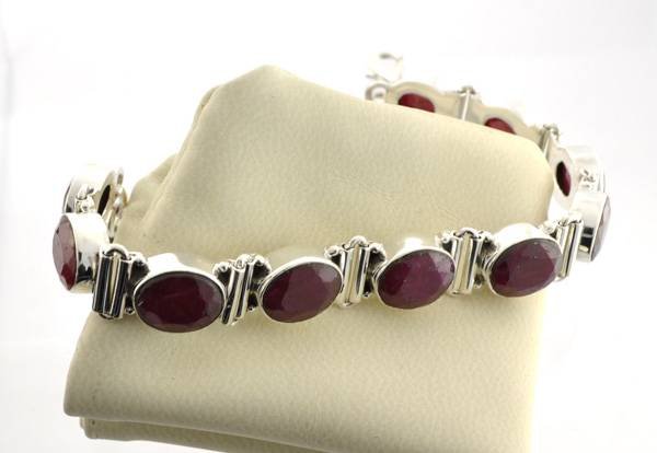 APP: 5k 29CTOval Cut Ruby & Sterling Silver Bracelet: 29.35CT Oval Cut Ruby and Sterling Silver Bracelet - Appraisal Value: $5.2K