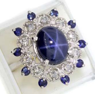 APP: 25k 14kt Gold, Cabochon Sapphire & Diamond Ring: 14 kt. White Gold, 6CT Oval Cabochon Cut Star Sapphire and 0.42CT Diamond Ring - Appraisal Value: $25.1K