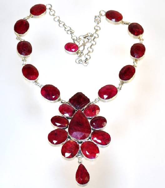 APP: 142.3k 227.66CT Ruby & Sterling Silver Necklace: 227.66CT Ruby and Sterling Silver Necklace - Appraisal Value: $142.3K