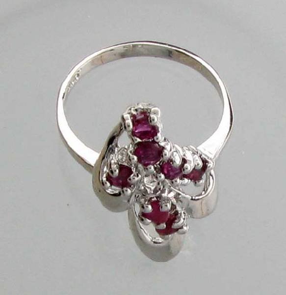 APP: 0.9k .60CT Round Cut Ruby & Sterling Silver Ring: .60CT Round Cut Ruby and Sterling Silver Ring - Appraisal Value: $0.8K