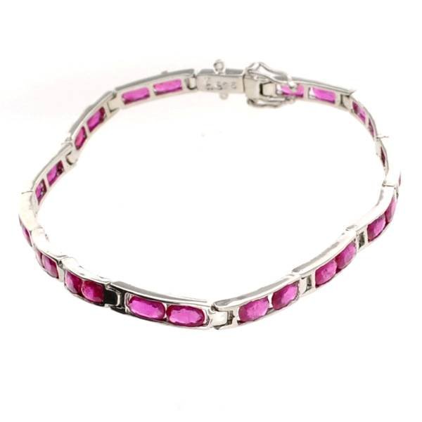 APP: 9k 4.55CT Oval Cut Ruby & Sterling Silver Bracelet: 4.55CT Oval Cut Ruby and Sterling Silver Bracelet - Appraisal Value: $9.6K