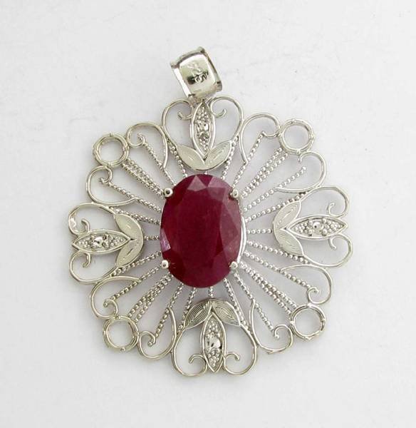 APP: 11k 8.63CT Oval Cut Ruby & Sterling Silver Pendant: 8.63CT Oval Cut Ruby and Sterling Silver Pendant - Appraisal Value: $11.6K