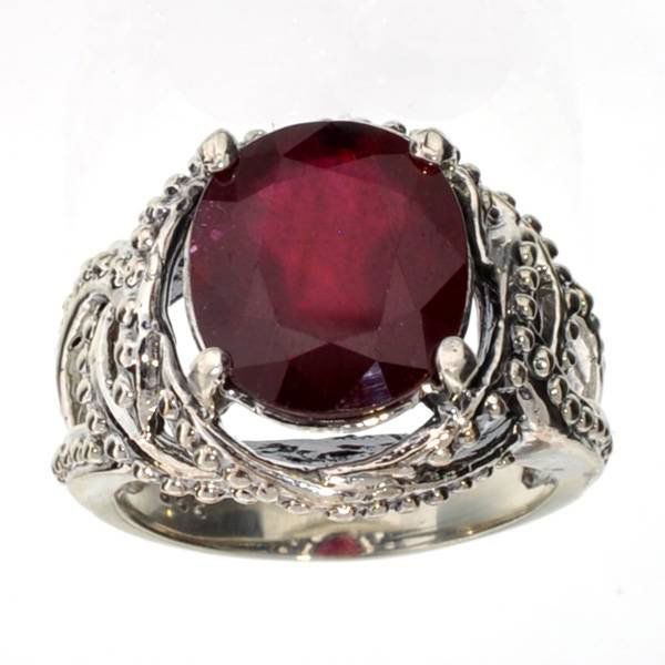 APP: 10k 6CT Oval Cut Ruby & Sterl Silver Ring: 6.77CT Oval Cut Ruby and Platinum Over Sterling Silver Ring - Appraisal Value: $10.1K