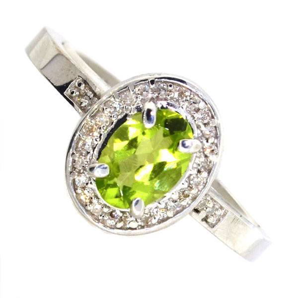 APP: 0k 0CT Oval Cut Peridot & Diamond Silver Ring: 0.73CT Oval Cut Peridot and Diamond Platinum Over Sterling Silver Ring - Appraisal Value: $0.9K