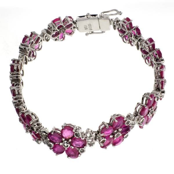 APP: 27k 19CT Ruby & Topaz Sterl Silver Bracelet: 19.82CT Ruby and Topaz Platinum Over Sterling Silver Bracelet - Appraisal Value: $27.2K