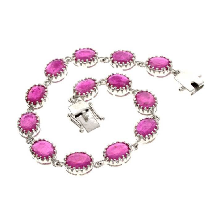 APP: 10k 12 CT Oval Cut Ruby & Sterling Silver Bracelet: 12.40CT Oval Cut Ruby and Sterling Silver Bracelet - Appraisal Value: $10.6K