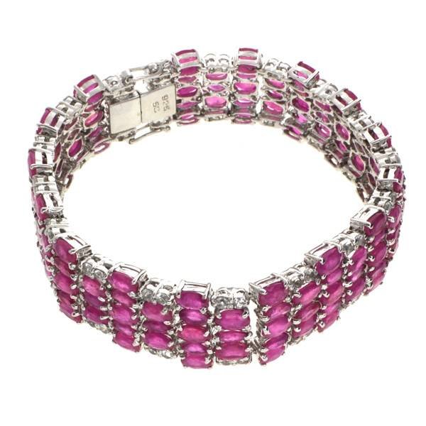 APP: 23k 34CT Ruby & Topaz Sterl Silver Bracelet: 34.95CT Ruby and Topaz Platinum Over Sterling Silver Bracelet - Appraisal Value: $23.2K