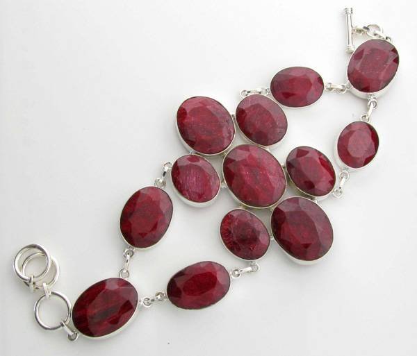 APP: 18k 80CT Oval Cut Ruby & Sterl Silver Bracelet: 80.50CT Oval Cut Ruby and Platinum Over Sterling Silver Bracelet - Appraisal Value: $18.7K
