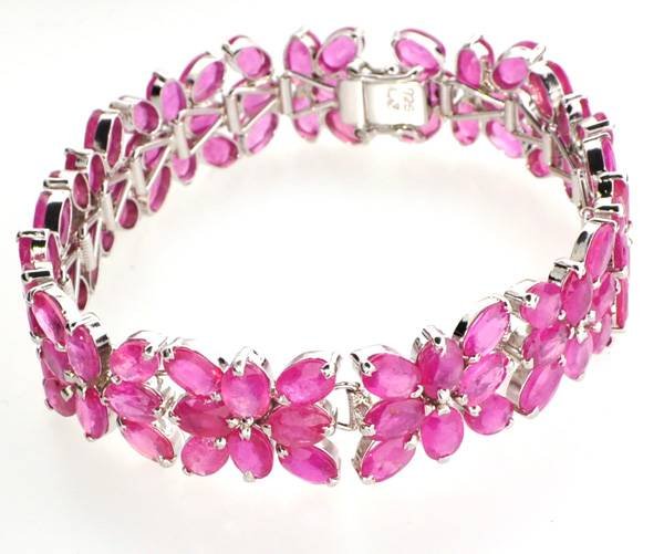 APP: 28k 42CT Oval Cut Ruby & Sterl Silver Bracelet: 42.61CT Oval Cut Ruby and Platinum Over Sterling Silver Bracelet - Appraisal Value: $28.7K