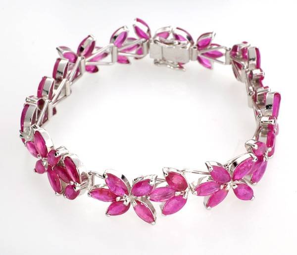 APP: 24k 23CT Marquise Cut Ruby & Silver Bracelet: 23.74CT Marquise Cut Ruby and Platinum Over Sterling Silver Bracelet - Appraisal Value: $24.8K