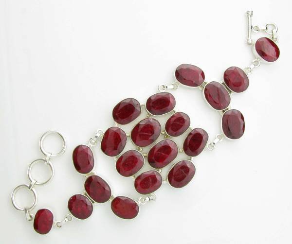 APP: 11k 163CT Oval Cut Ruby & Sterl Silver Bracelet: 163.53CT Oval Cut Ruby and Sterling Silver Bracelet - Appraisal Value: $11.7K <