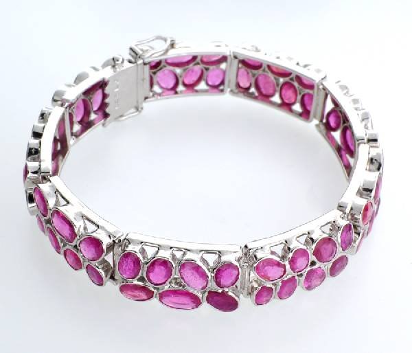 APP: 21k 33CT Mixed Cut Ruby & Sterl Silver Bracelet: 33.88CT Mixed Cut Ruby and Platinum Over Sterling Silver Bracelet - Appraisal Value: $21.3K
