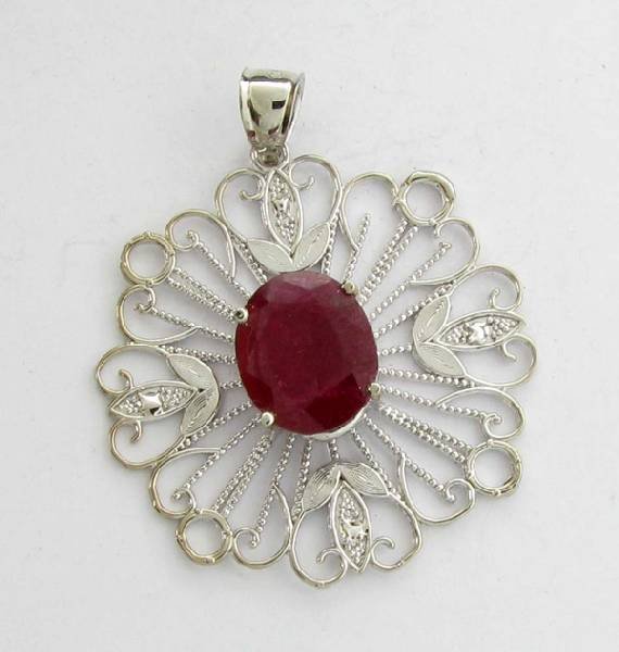 APP: 12k 9.47CT Oval Cut Ruby & Sterling Silver Pendant: 9.47CT Oval Cut Ruby and Sterling Silver Pendant - Appraisal Value: $12.7K