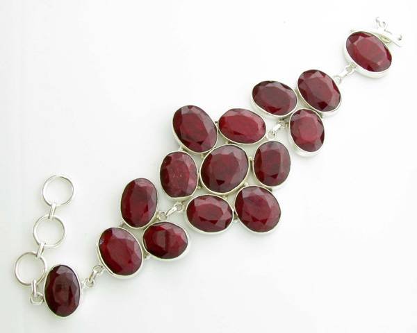 APP: 13k 66CT Oval Cut Ruby & Sterl Silver Bracelet: 66.10CT Oval Cut Ruby and Platinum Over Sterling Silver Bracelet - Appraisal Value: $13.4K