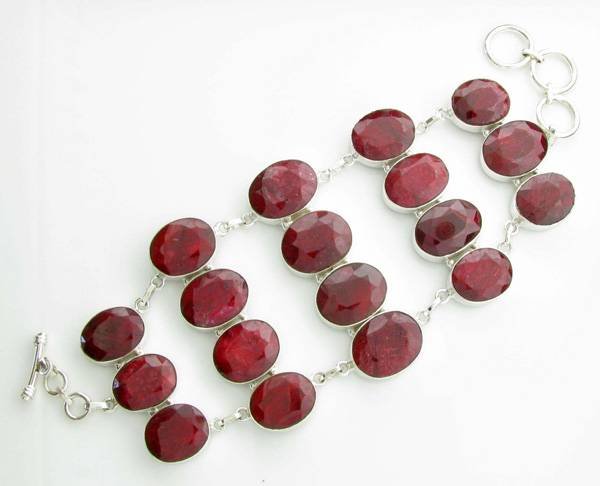 APP: 15k 74CT Oval Cut Ruby & Sterl Silver Bracelet: 74.30CT Oval Cut Ruby and Platinum Over Sterling Silver Bracelet - Appraisal Value: $15.8K