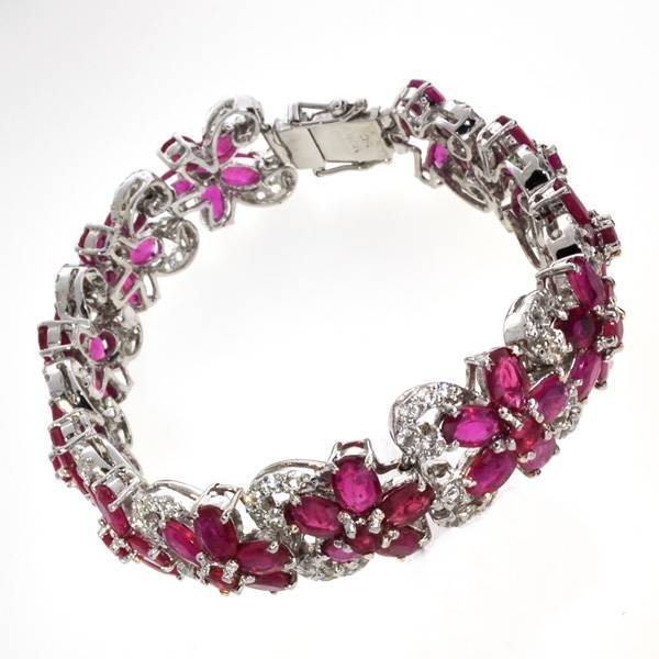 APP: 30k 47CT Ruby & Topaz Sterl Silver Bracelet: 47.41CT Ruby and Topaz Platinum Over Sterling Silver Bracelet - Appraisal Value: $30.7K