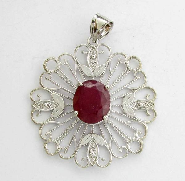 APP: 12k 9.05CT Oval Cut Ruby & Sterling Silver Pendant: 9.05CT Oval Cut Ruby and Sterling Silver Pendant - Appraisal Value: $12.1K