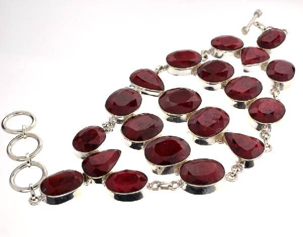 APP: 19k 240CT Mixed Cut Ruby & Sterl Silver Bracelet: 240.42CT Mixed Cut Ruby and Sterling Silver Bracelet - Appraisal Value: $19.7K