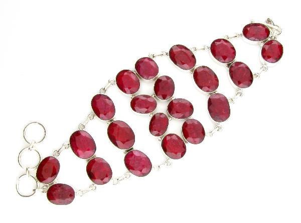 APP: 12k 133CT Oval Cut Ruby & Sterl Silver Bracelet: 133.37CT Oval Cut Ruby and Sterling Silver Bracelet - Appraisal Value: $11.9K <