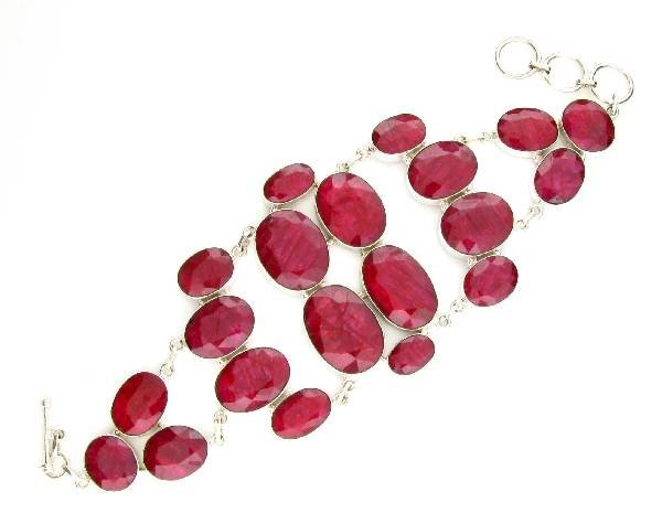 APP: 17k 214CT Oval Cut Ruby & Sterl Silver Bracelet: 214.19CT Oval Cut Ruby and Sterling Silver Bracelet - Appraisal Value: $17.3K <