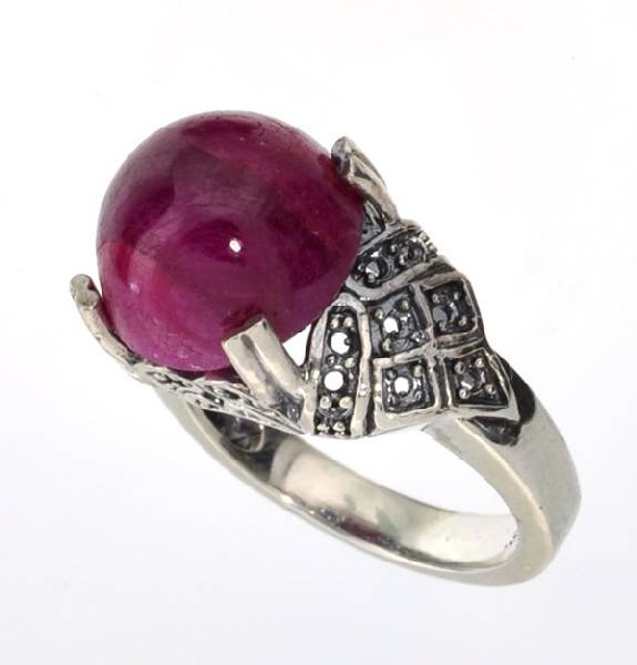 APP: 3k 12CT Oval Cabochon Ruby & Sterl Silver Ring: 12.98CT Oval Cabochon Ruby and Platinum Over Sterling Silver Ring - Appraisal Value: $3.7K