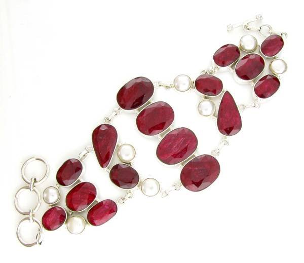 APP: 13k 144CT Ruby & Button Pearl Silver Bracelet: 144.99CT Ruby and Button Pearl Sterling Silver Bracelet - Appraisal Value: $13.0K