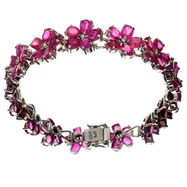 APP: 15k 24CT Oval Cut Ruby & Sterl Silver Bracelet: 24.22CT Oval Cut Ruby and Platinum Over Sterling Silver Bracelet - Appraisal Value: $15.0K