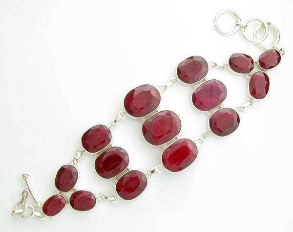 APP: 10k 139CT Oval Cut Ruby & Sterl Silver Bracelet: 139.67CT Oval Cut Ruby and Sterling Silver Bracelet - Appraisal Value: $10.1K <